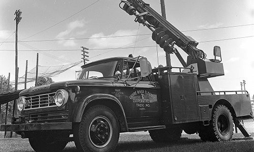 A black and white photo of a CREC service truck