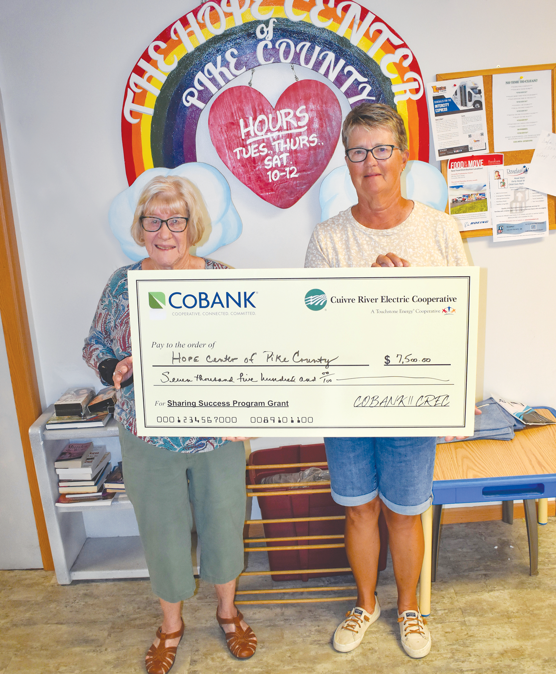 From left, Jeff Geisendorfer, Mike Cherry, Cuivre River Electric board directors; Valerie Levy, librarian, Powell Memorial Library, and Dr. Matt Frederickson, superintendent, both of Lincoln County R-III School District.
