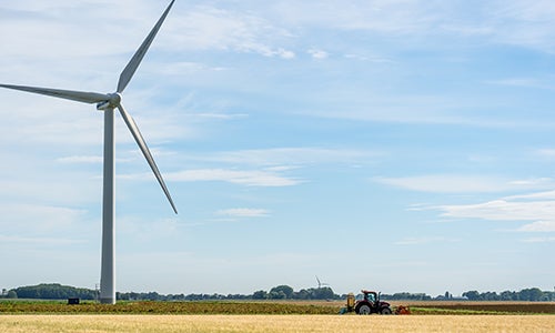 A wind turbine in a field.