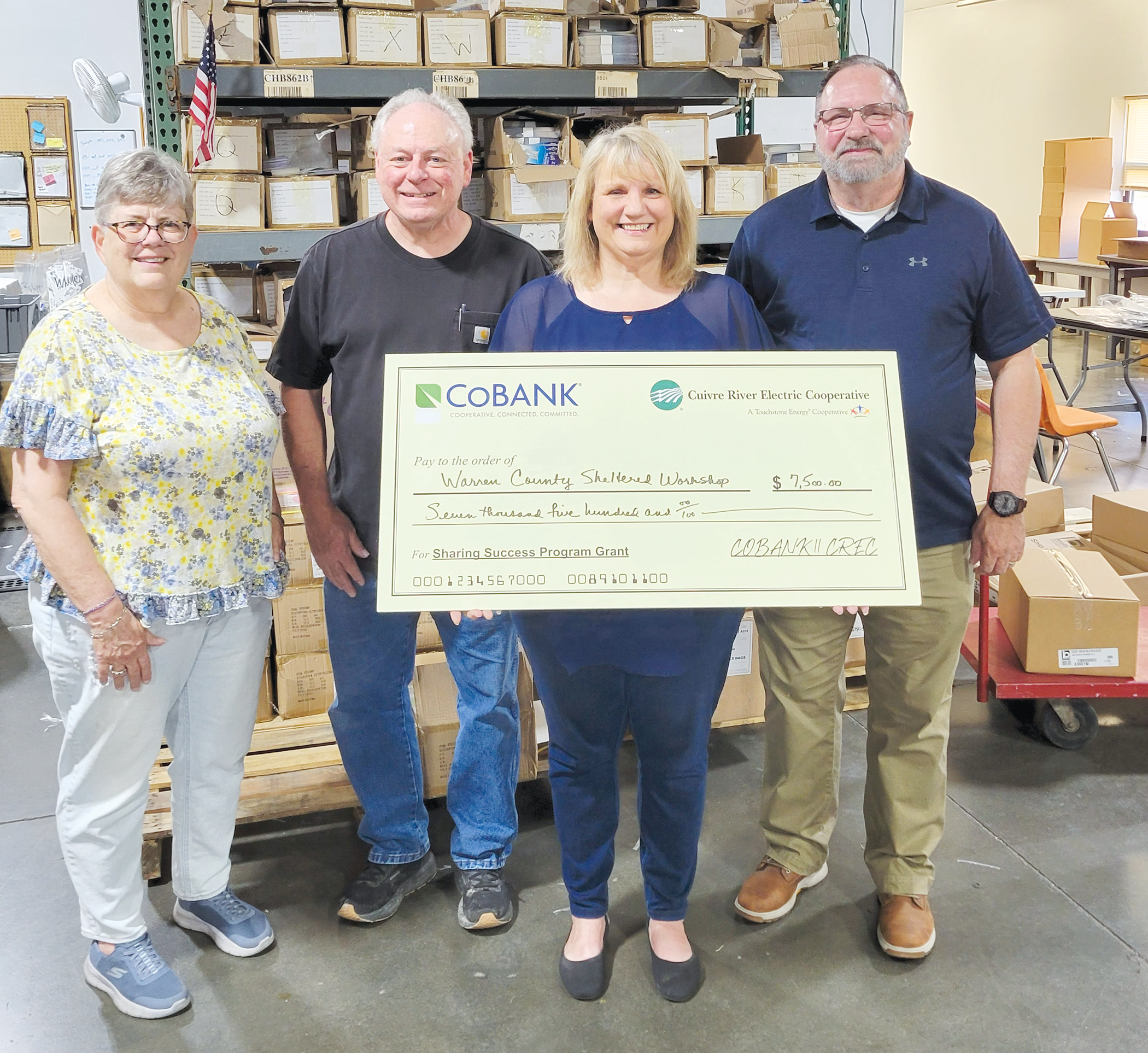 From left, all representing Warren County Sheltered Workshop, Lisa Grace, human resources manager, Derrick Moreau, production manager, Jami Washburn, executive director; with Phil Dunk, Cuivre River Electric Cooperative board director.