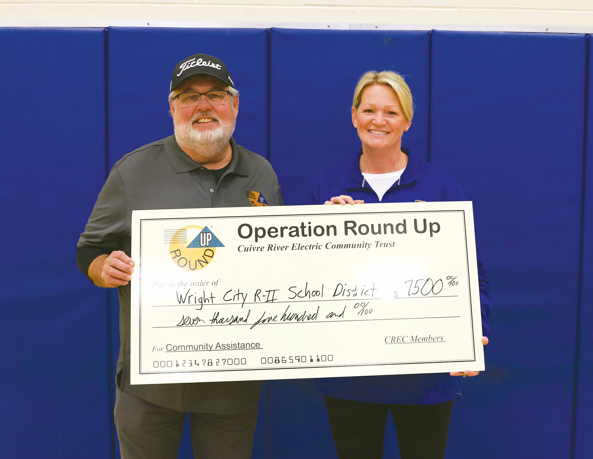 The Cuivre River Electric Community Trust Board recently awarded a $7,500 Operation Round Up grant to the Wright City R-II School District. The funds will help the district launch a bicycle program for its elementary schools. Pictured, from left, are Trust Board member Rich Barton and Jen Hamilton, physical education teacher.