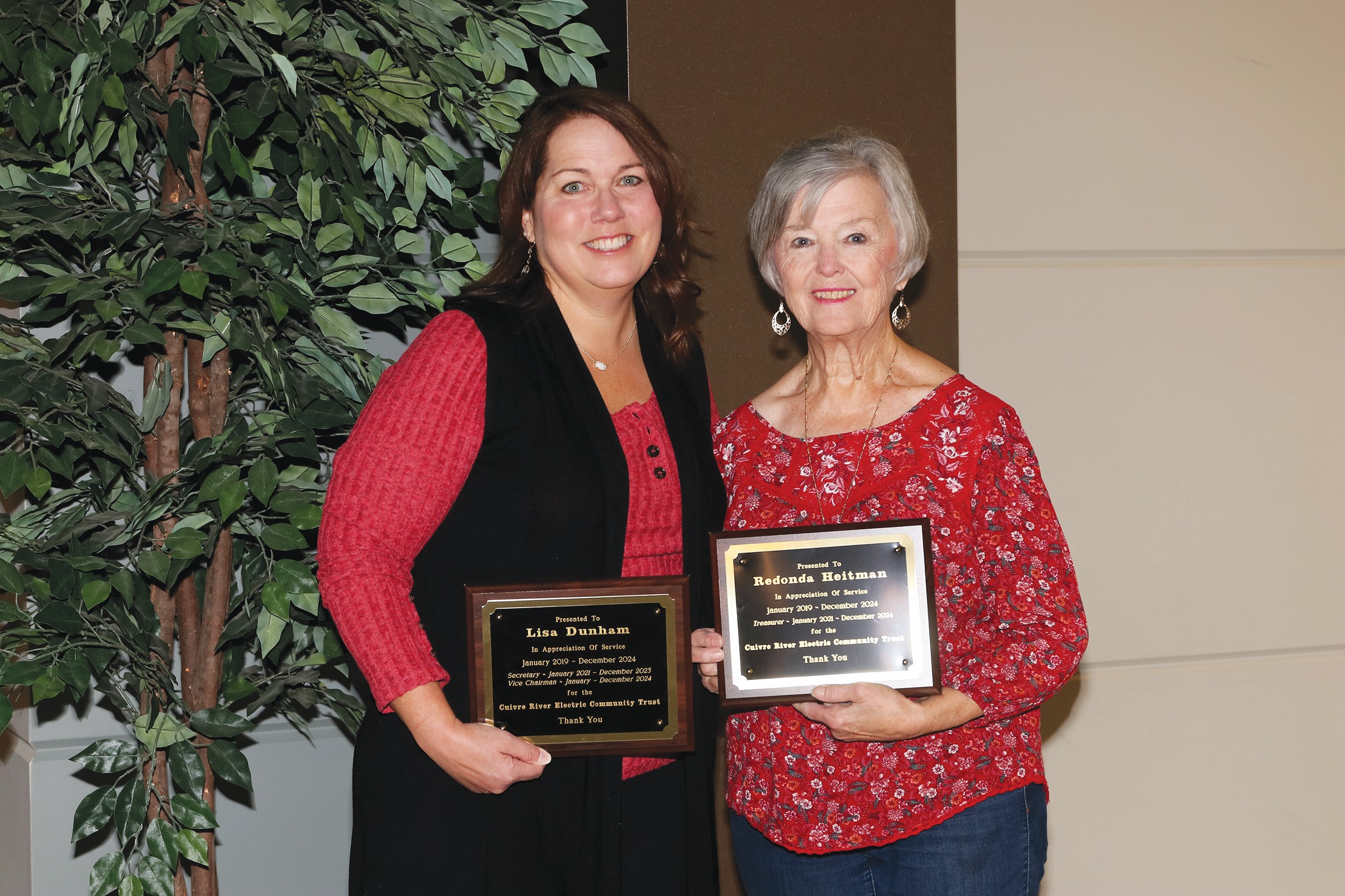 Lisa Dunham, left, and Redonda Heitman were presented with plaques recognizing their six years of service on the Cuivre River Electric Community Trust Board.