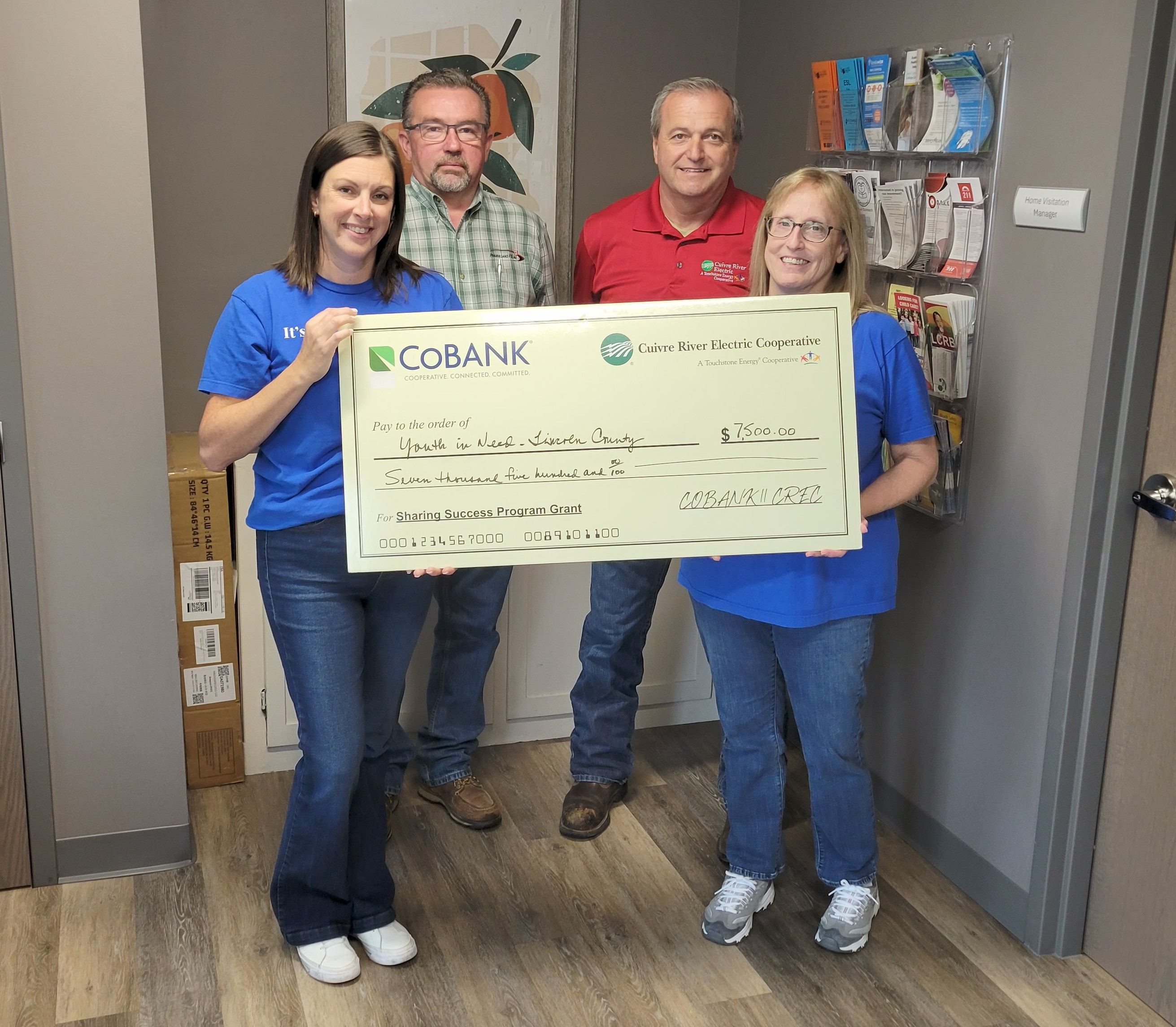From left, Meghan Brown, Center Manager, Youth in Need; Jeff Geisendorfer, CREC Board Director; Mike Cherry, CREC Board Director; Angie Mueller-Akins, Home Visitation Manager, Youth in Need.