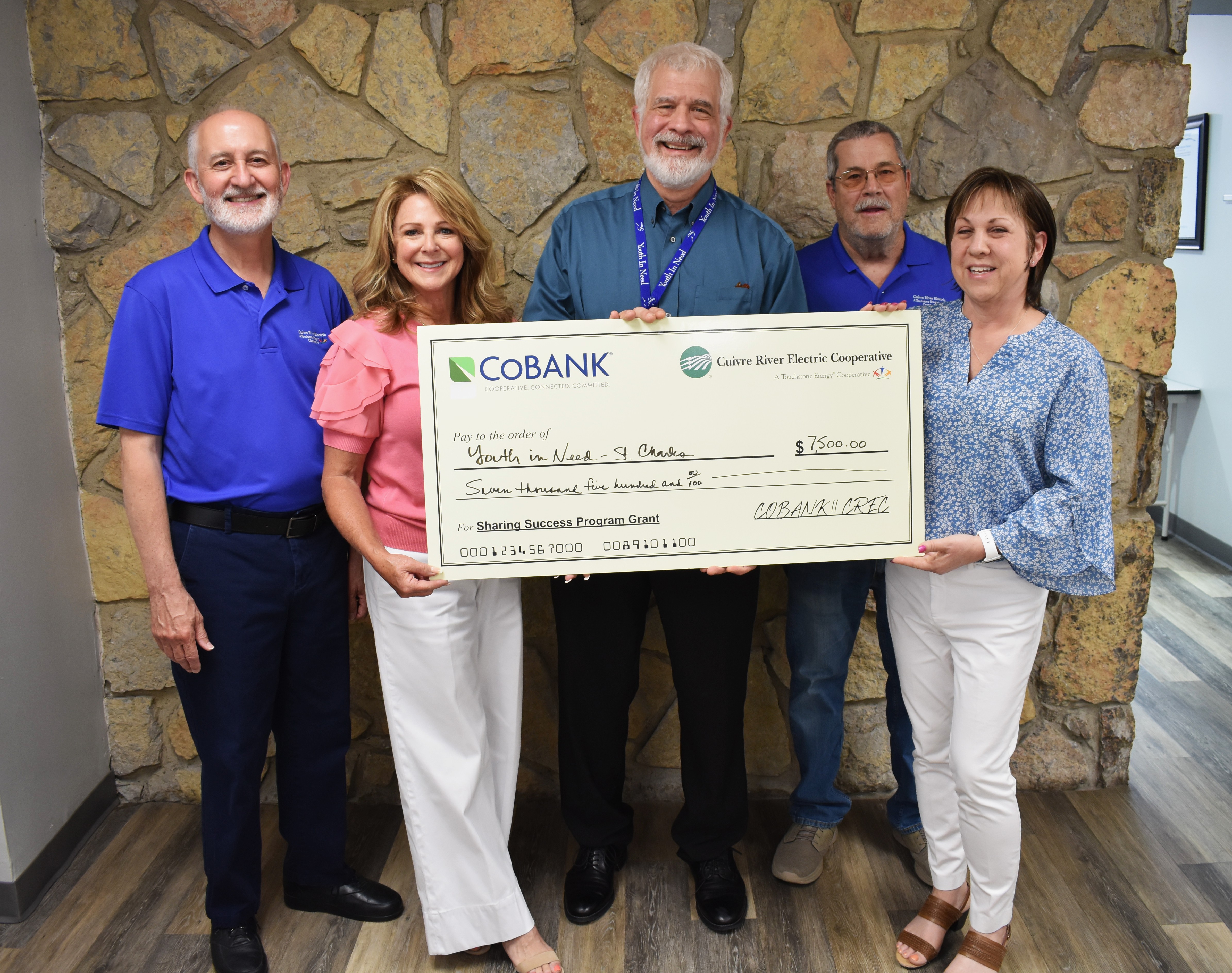 From left, Ted House, CREC Board Secretary and Treasurer; Diane Saale, CREC Board President; Rob Muschany, Chief Development Officer, Youth in Need; Mark Schulte, CREC Board Director; Karen Berra, CREC Board Director.